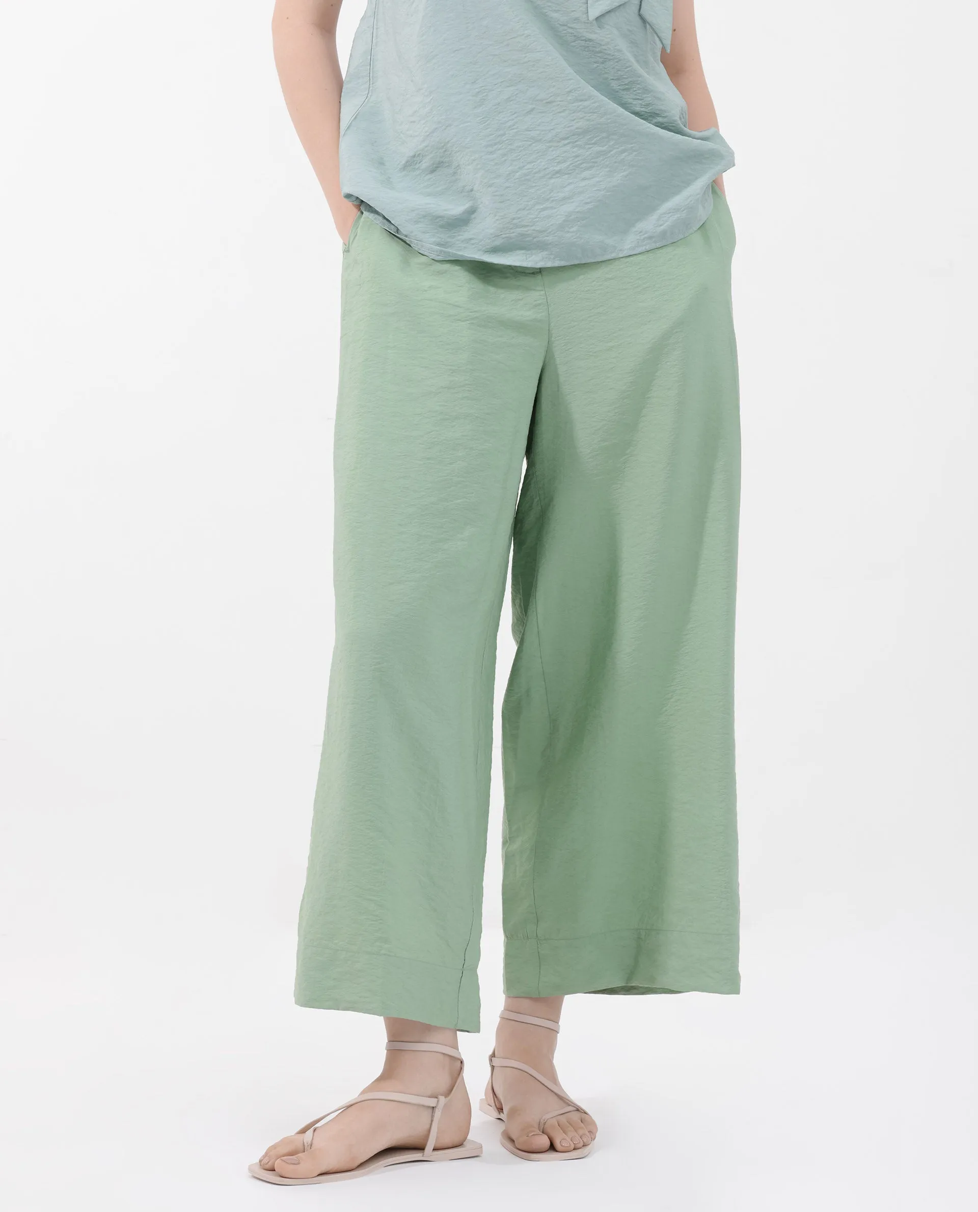 Rareism Women Millinia Pastel Green Viscose Nylon Fabric Button Closure Straight Fit Plain Ankle Length Trousers